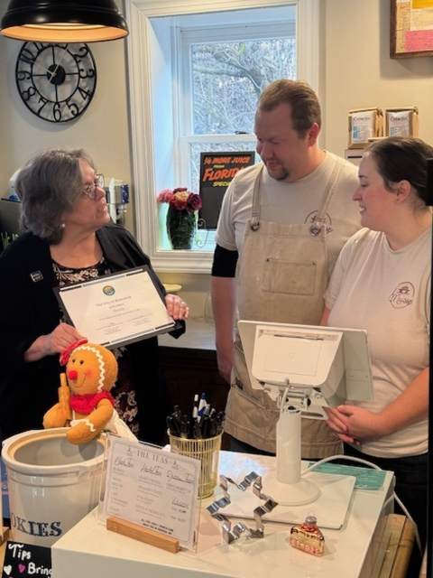 Brunswick City Administrator, Julie Martorana, welcomes Maison's owners, Mathew and Emma Tilman