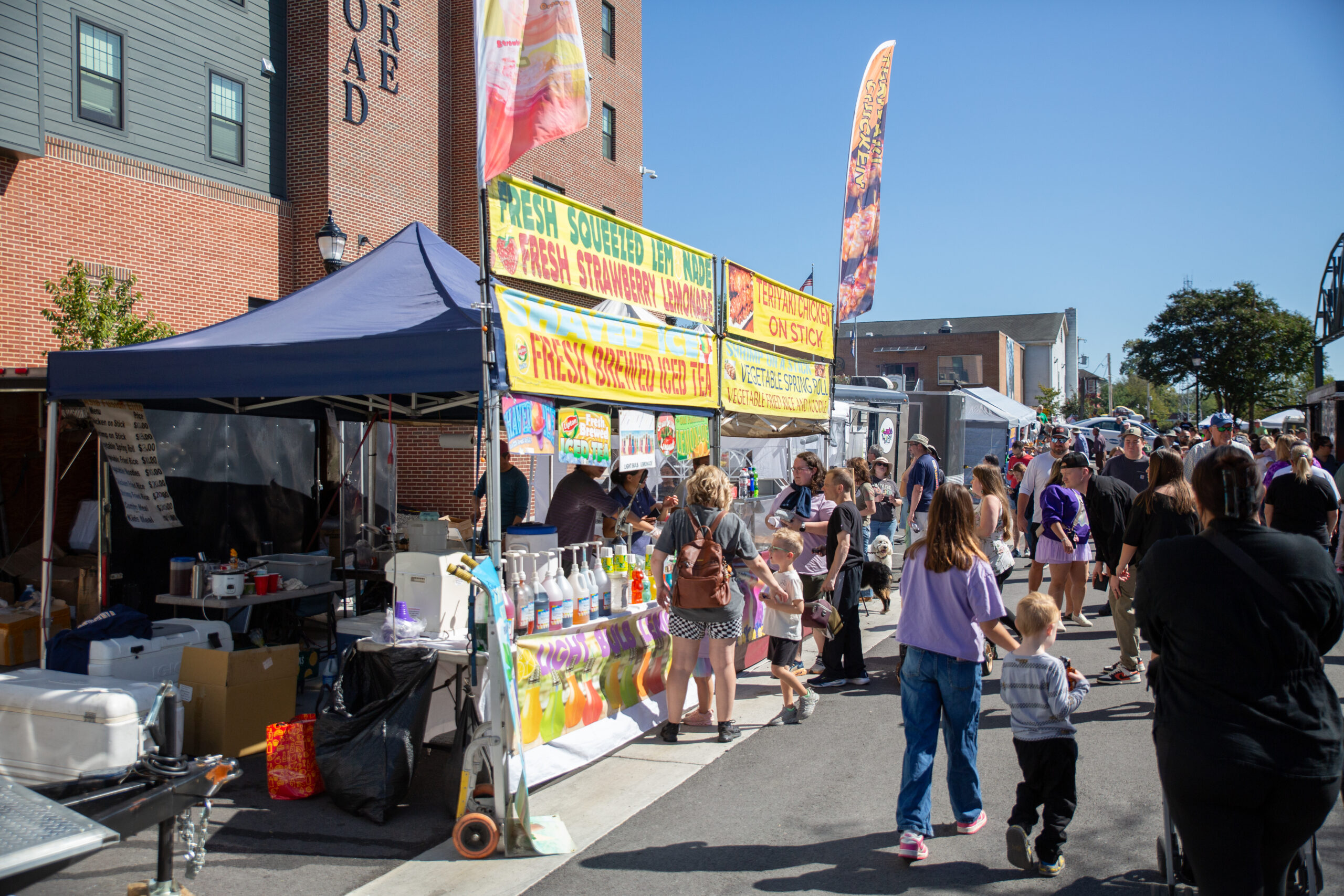 A crowd of people at the Railroad Days event in Downtown Brunswick, Maryland. 