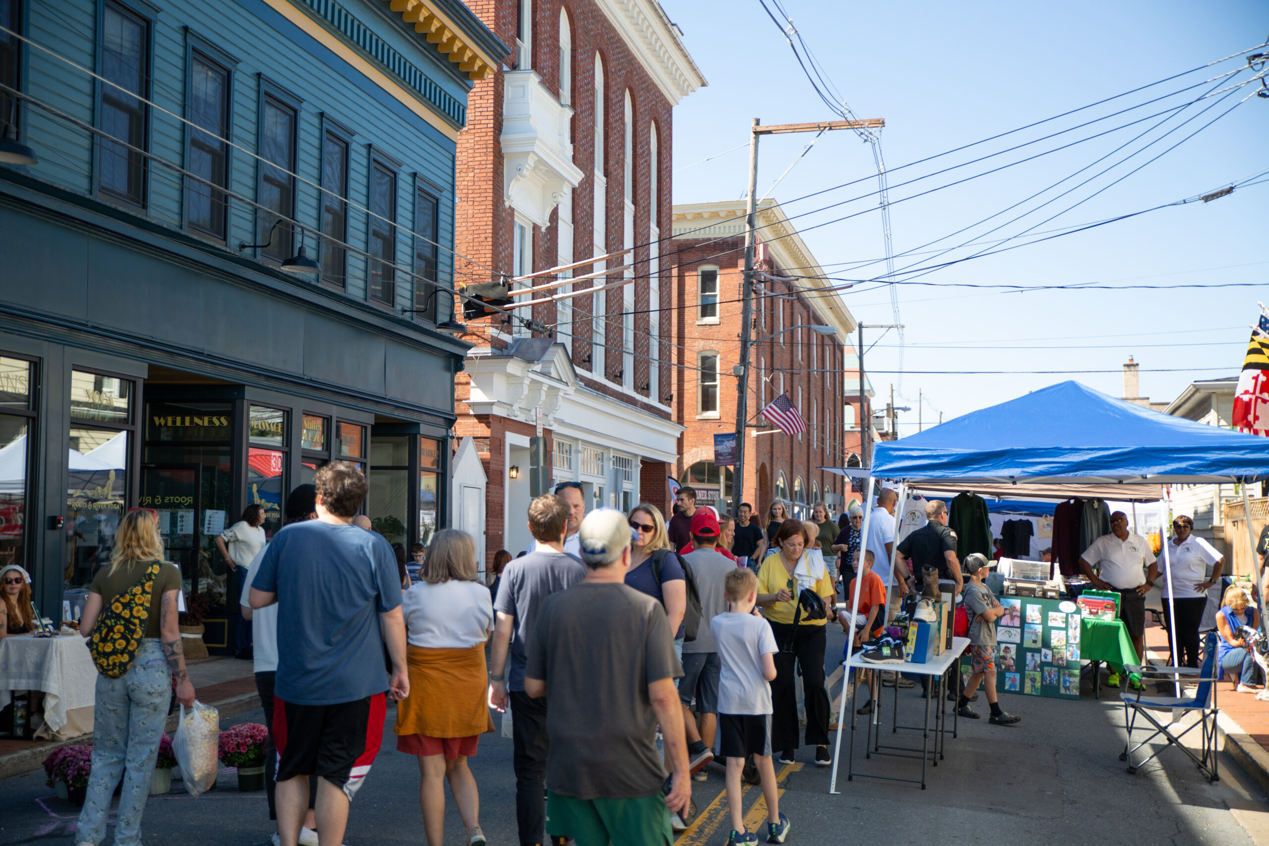 Crowd of people walking in downtown Brunswick, Maryland during the Railroad Days festival. 