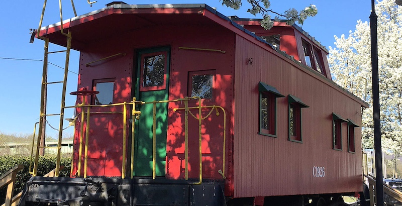 red caboose on train tracks