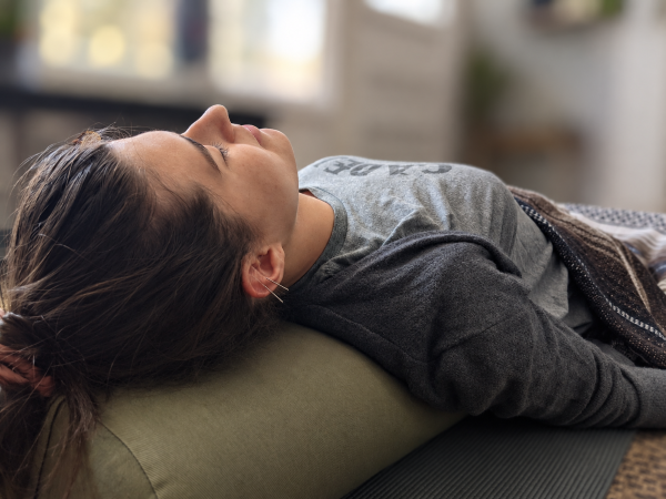 An event photo promoting acupuncture in the Roots and River yoga studio in Brunswick, MD.