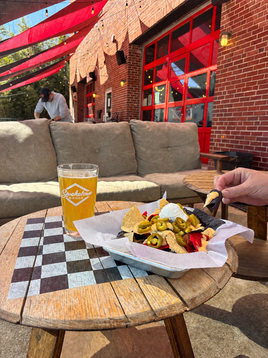 Food and a beer outside on the patio at Smoketown Brewing in Brunswick, Maryland.